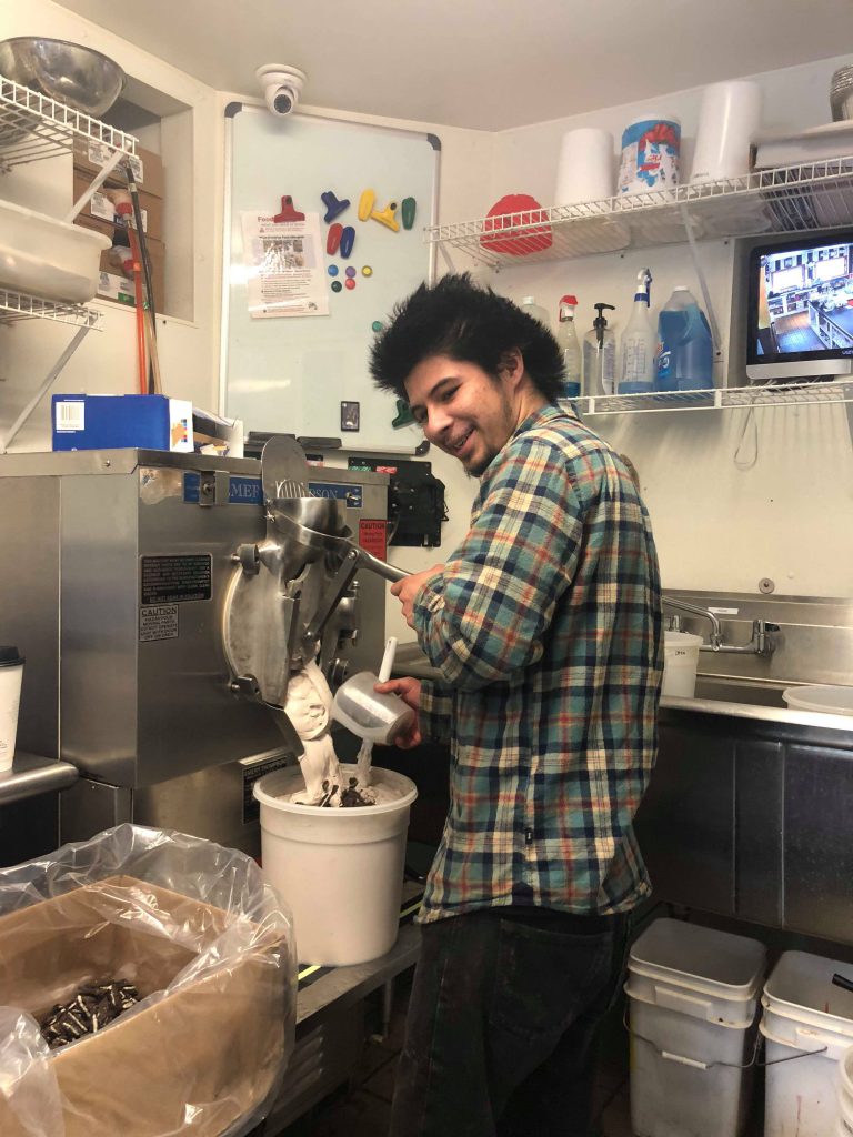 Young man making ice cream