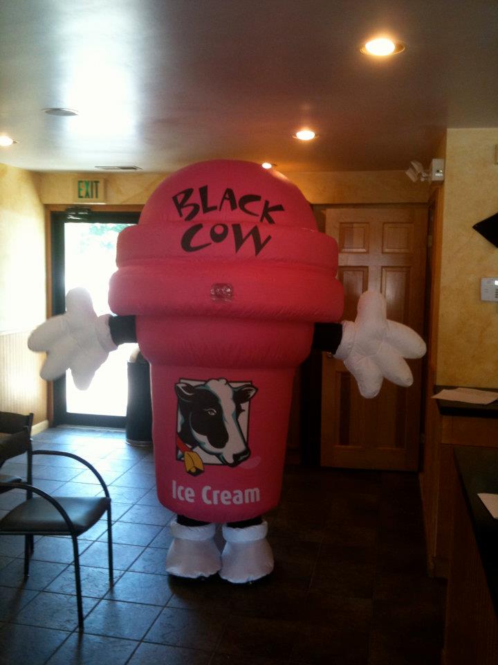 Black cow ice cream cup mascot