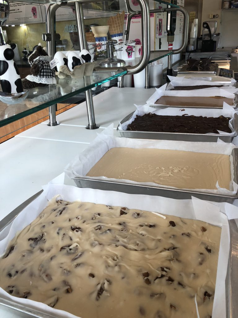 Large trays of homemade fudge on a countertop